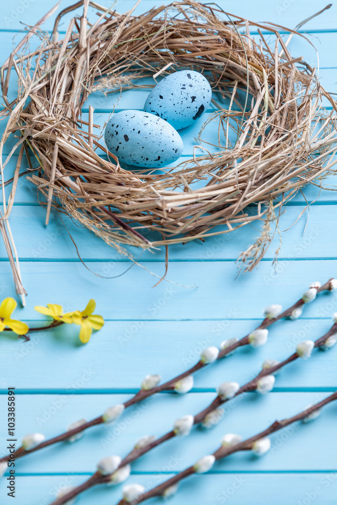 Obraz premium Easter eggs on a wooden background