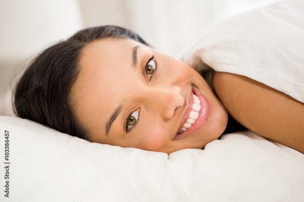Happy brunette on bed Happy brunette on bed