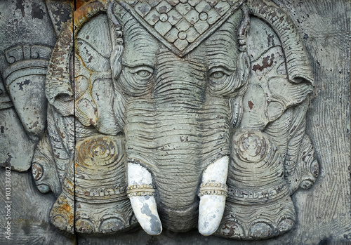 Elephant god statue on public temple wall in Thailand