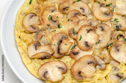 Delicious omelet with mushrooms and tomatoes