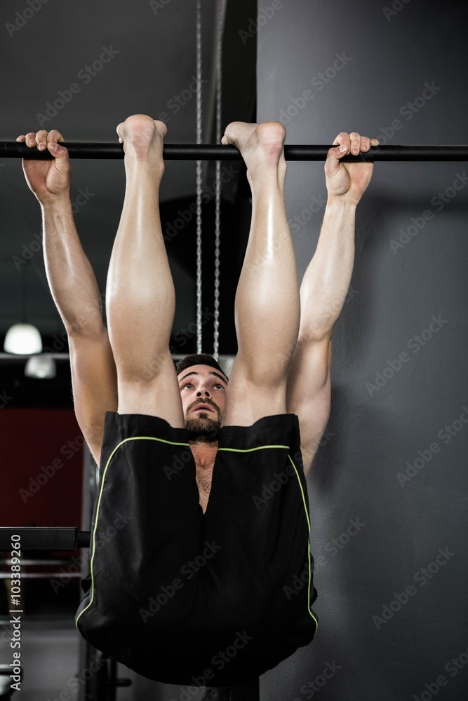 Shirtless man doing pull up Shirtless man doing pull up