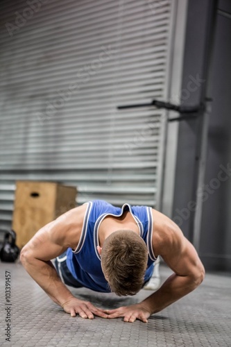 Muscular man doing push up