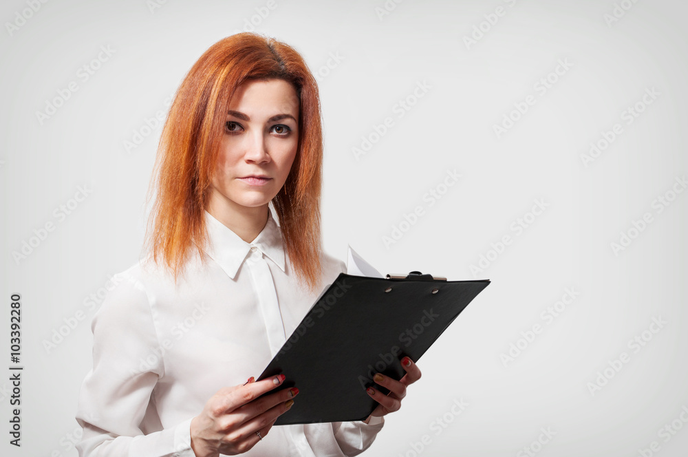 Young businesswoman with clipboard against white background Young businesswoman with clipboard against white background