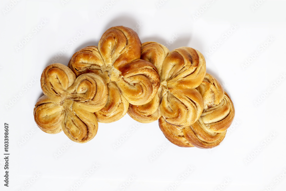 sweet bun with cinnamon on white background
