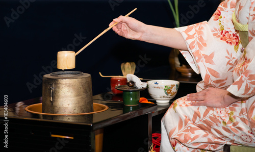 Japanese tea ceremony is perfomed by tea master (shallow DOF) photo