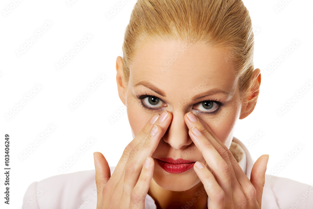 Young business woman with sinus pressure pain Young business woman with sinus pressure pain