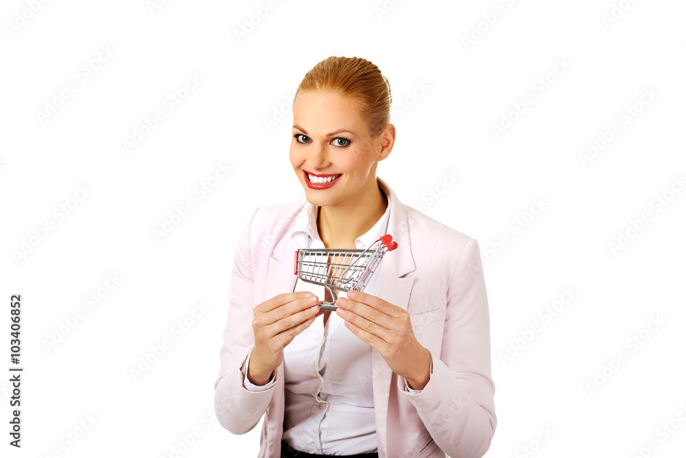 Attractive business woman holding small trolley Attractive business woman holding small trolley
