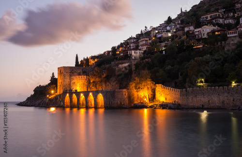 Fotografie Evening view of harbour, fortress and ancient shipyard in Alanya, Turkey