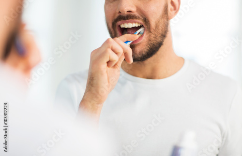 Принти на полотні close up of man with toothbrush cleaning teeth