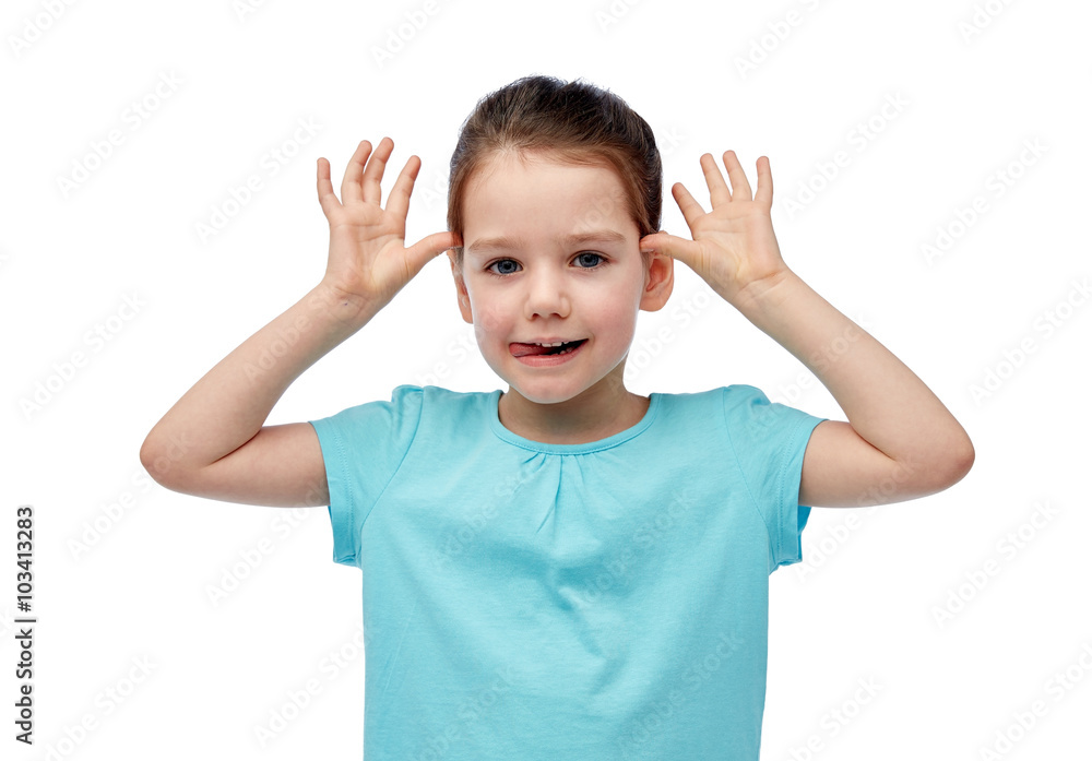 happy little girl having fun and making ears happy little girl having fun and making ears