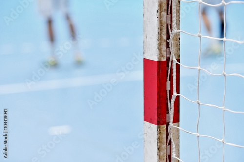 Handball goalpost with players in background