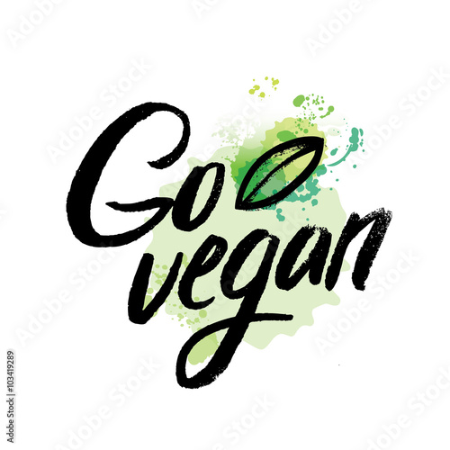 Words GO VEGAN in simple and cute frame with green branches and leaves. Vectorized watercolor drawing.