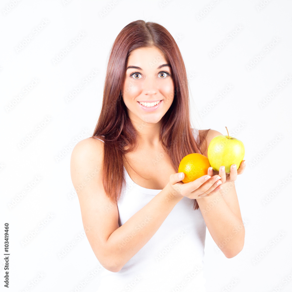 Woman with orange and apple in hands. Healthy lifestyle. Woman with orange and apple in hands. Healthy lifestyle.