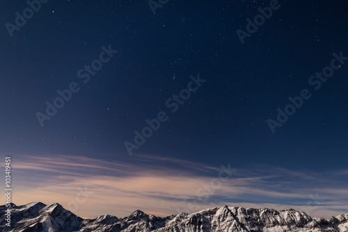The starry sky above the Alps in winter, Orion Constellation