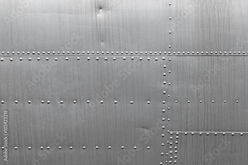 Abstract metallic background. Silver metal texture with rivets.