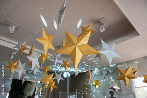 Room is decorated with paper stars