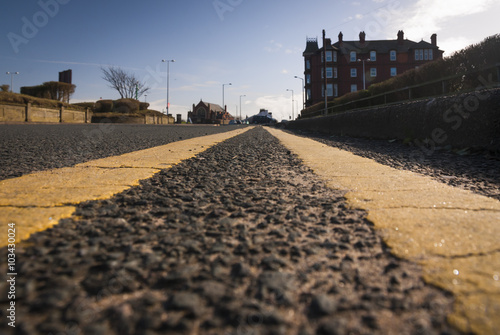 A worms eye view of double yellow lines in the UK. photo