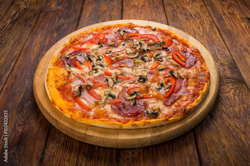 Delicious pizza with mushrooms and smoked chicken