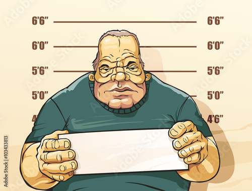 Caughted criminal stands beside wall with number in hands. His take pictures for police documents.