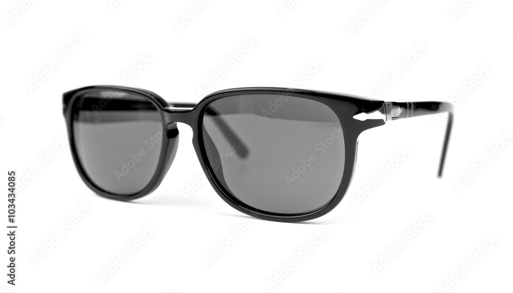 Cool sunglasses isolated on white background. In black plastic frame. Front view. Close up.