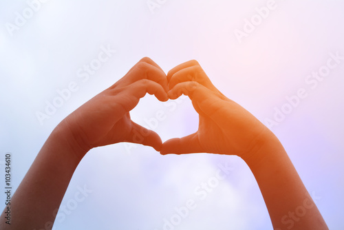 Human hands making a heart shape