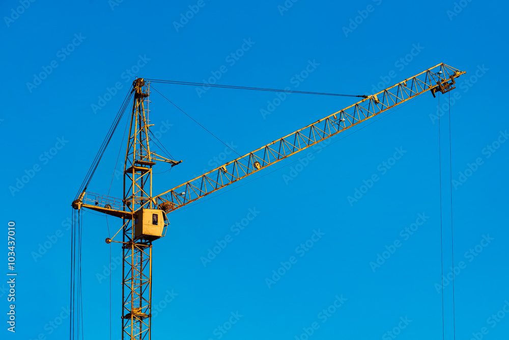 Closeup image of crane lifting bricks for civil building Closeup image of crane lifting bricks for civil building