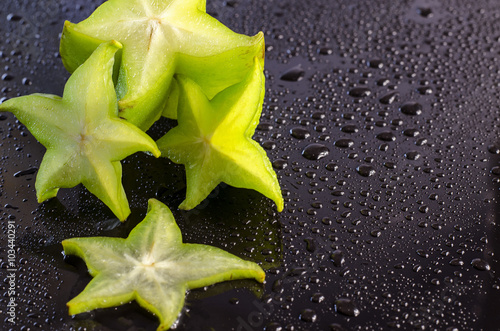 carambola on a black background photo