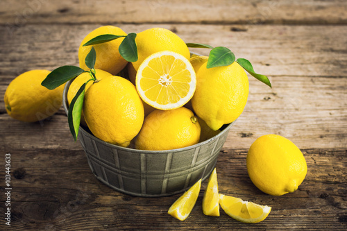 Fresh lemons on the rustic tale
