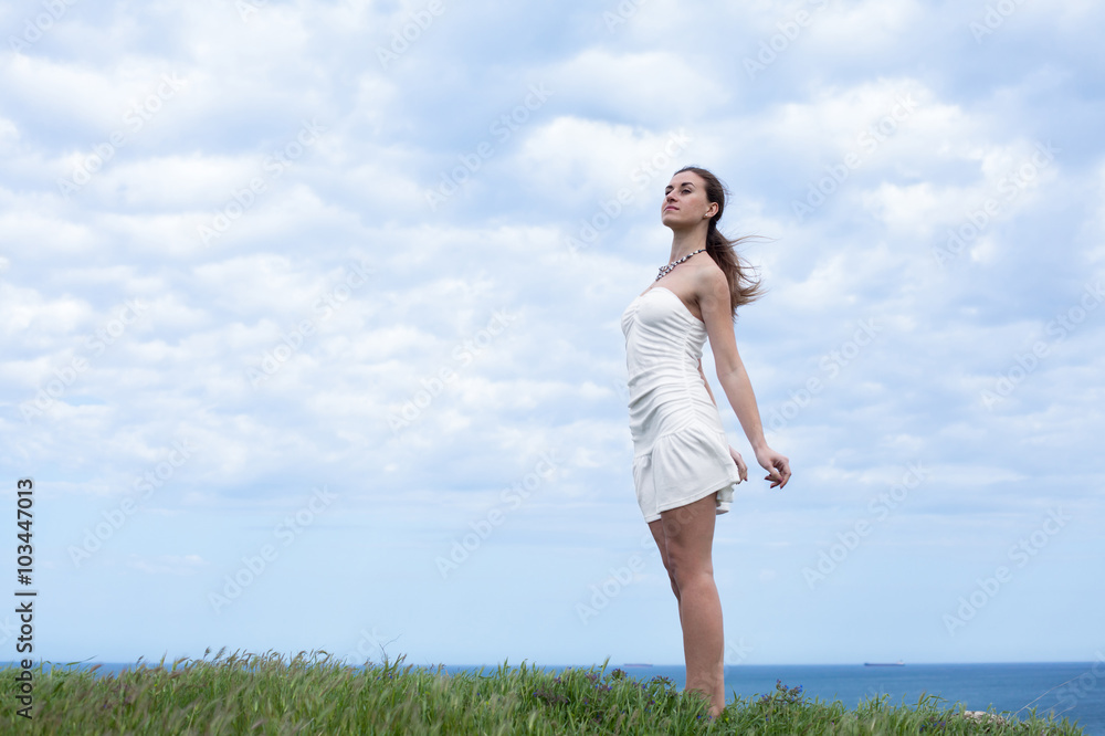 Girl in white on open air. Attractive young woman in white dress Girl in white on open air. Attractive young woman in white dress