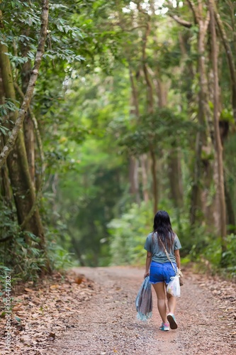 Woman walking in jungle