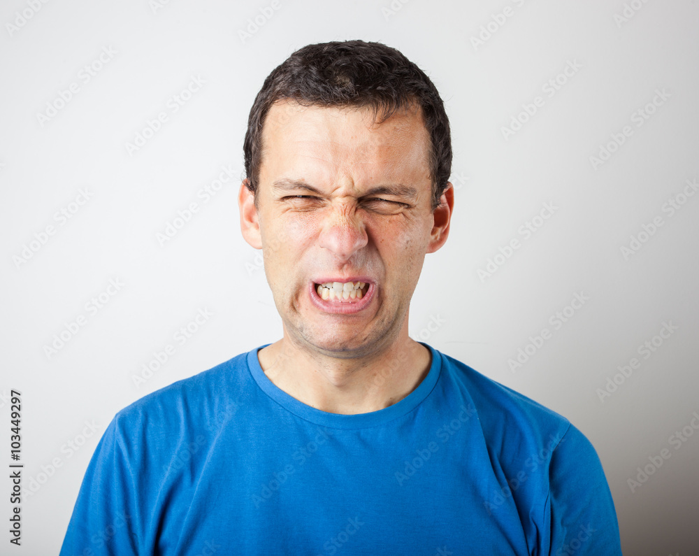 Fototapeta premium Young man expressing emotions