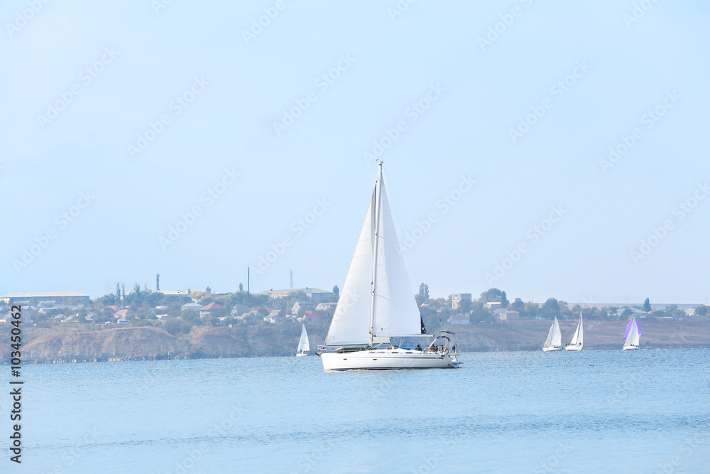 Sailing yacht on river