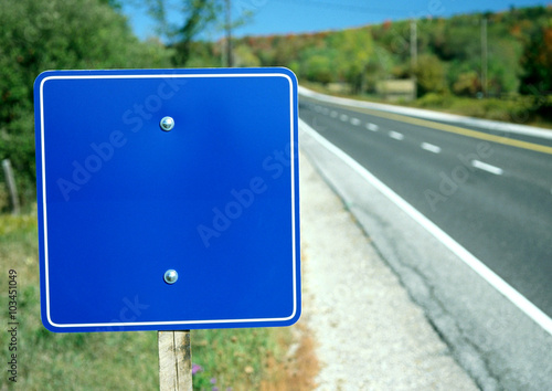 Road sign near the road photo