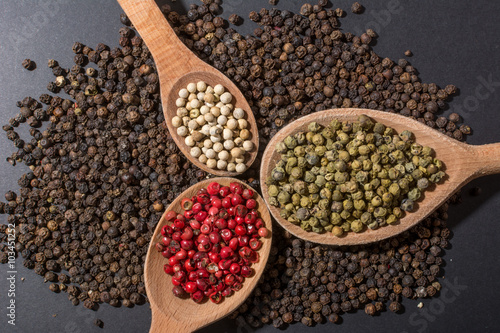 4 colors of peppercorns od wooden spoons