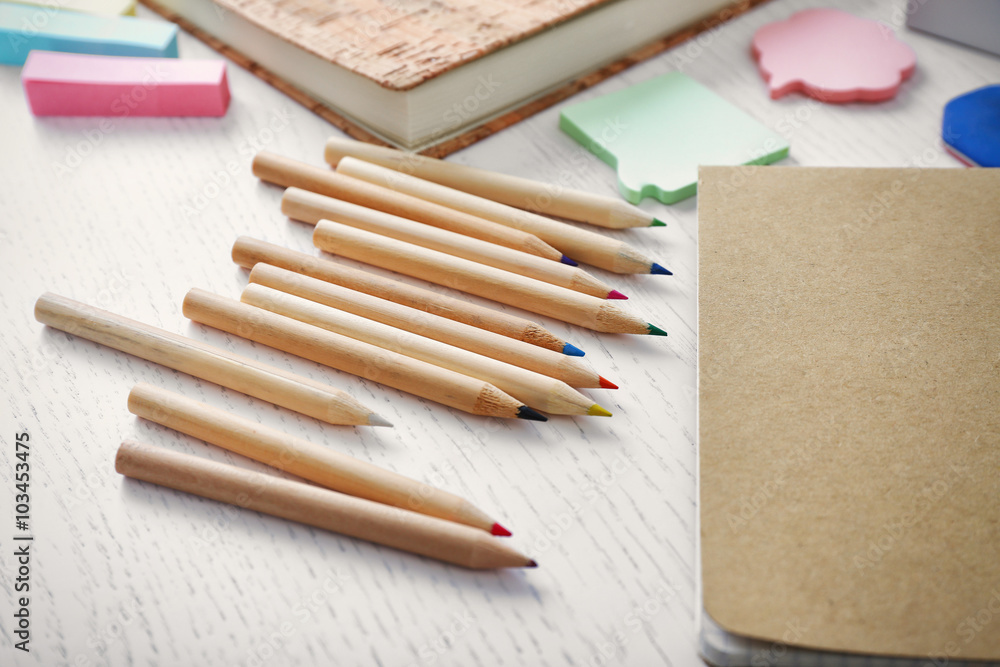 Naklejka premium Notebooks with stationery on a white table