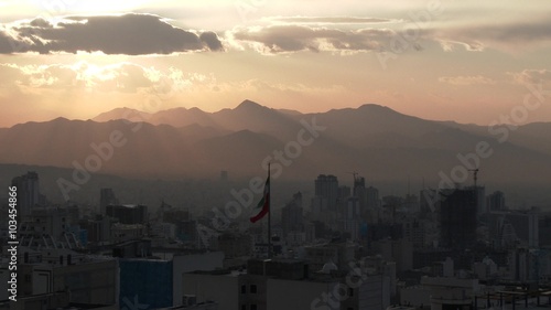 TEHRAN, IRAN JANUARY 2015: Iranian flag in the middle of Tehran city. photo