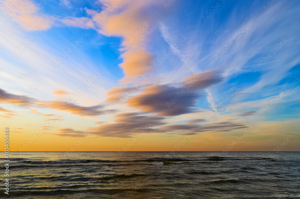 Stunning stratus cloud formations at sunset over the Baltic sea. Gdansk Bay, Pomerania, northern Poland.