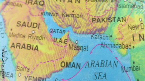 Terrestrial globe smoothly rotates and stops at the map of Saudi Arabia photo
