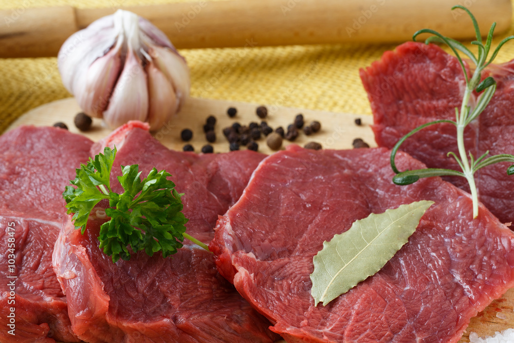 Raw beef meat on a cutting board