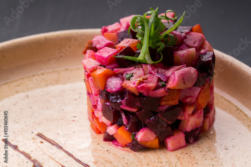 Fresh salad with beets on rustic plate