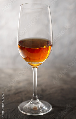 Fotografie, Obraz Glass of amontilliado sherry on wooden plank