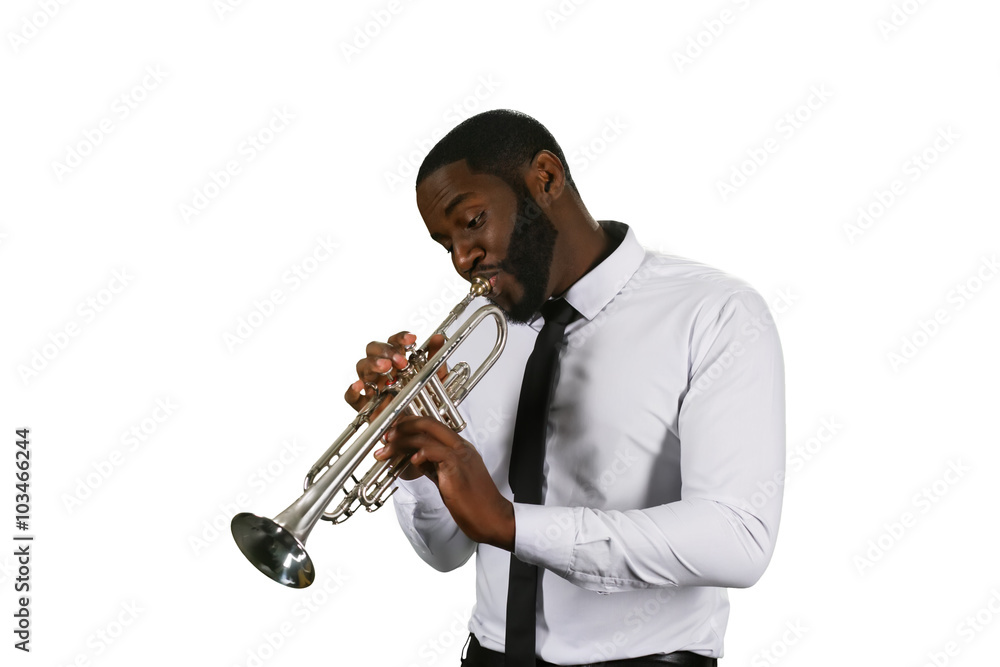 Naklejka premium Darksinned musician with a trumpet.