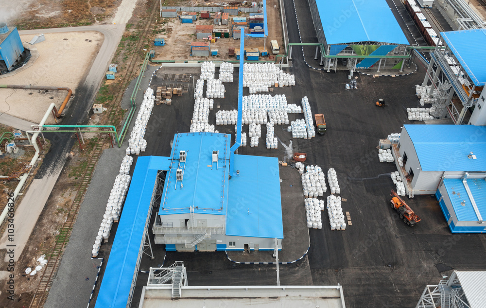 Chemical plant for production of ammonia and nitrogen fertilization on day time. Open area for finished products.  Top view. Focus on the center of the frame