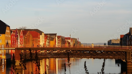 Panoramic view of bridge to famous wooden colored houses in Trondheim city, Norway - architecture background