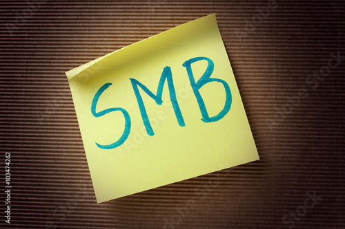 SMB (Small Medium-sized Business) acronym on yellow sticky note