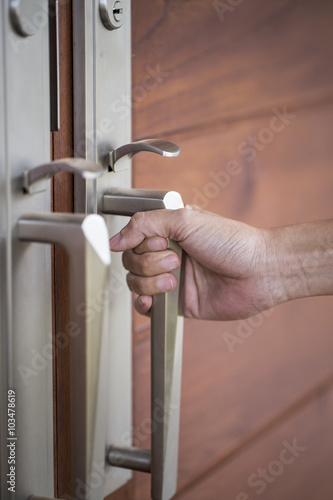 hand hold handle of wood door