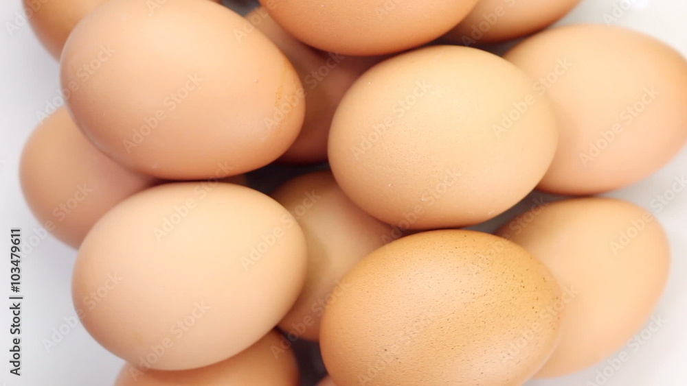 Rotating of egg on white background, top view
Rotating of egg on white background, top view