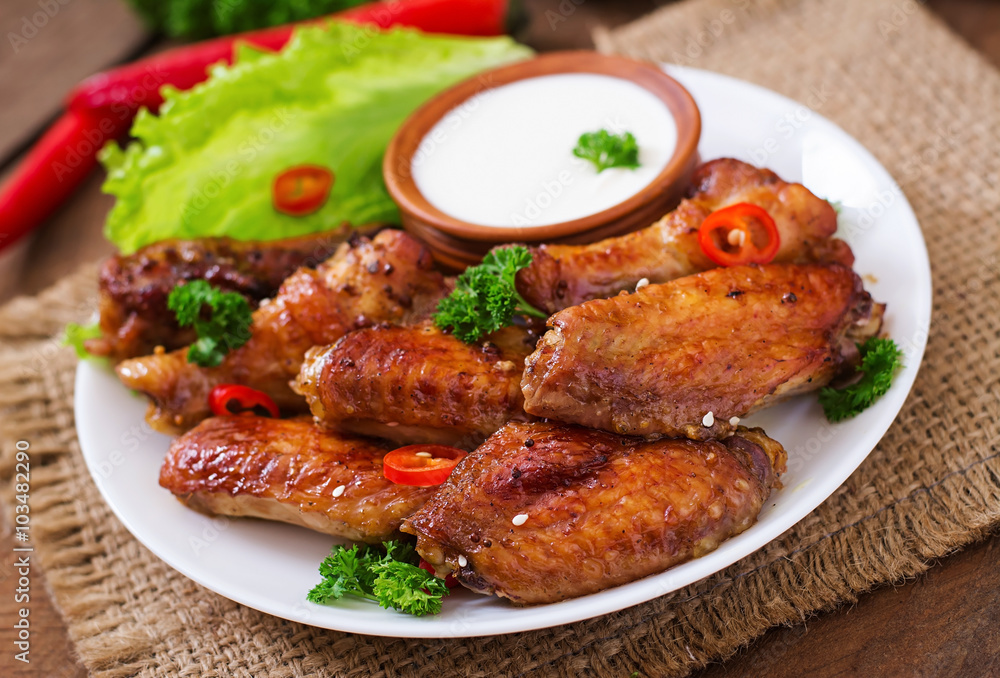 Sour-sweet baked chicken wings and sauce Sour-sweet baked chicken wings and sauce