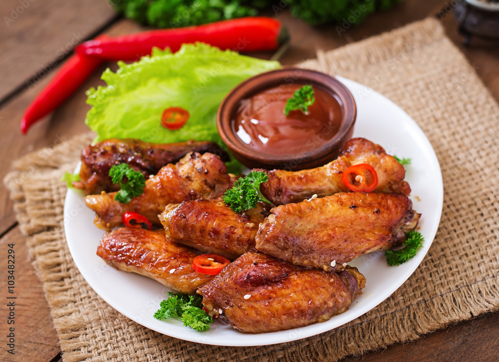 Sour-sweet baked chicken wings and sauce Sour-sweet baked chicken wings and sauce