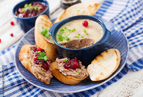 Chicken liver pate with cranberry sauce, served with croutons